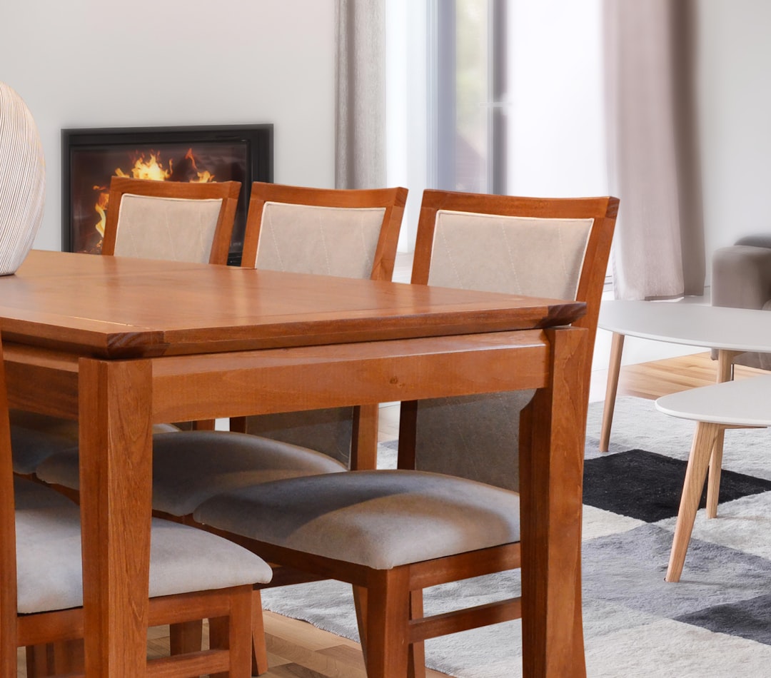 wooden-dining-table-with-upholstered-chairs-and-fireplace-2ejatshbxd0